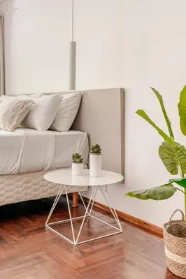 a living room with a white couch and a table at Departamentos Lugar in Cordoba