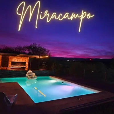 a swimming pool with a sign that reads muncump at MIracampo in San Antonio de Arredondo