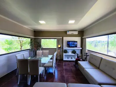 a living room with a table and a couch at MIracampo in San Antonio de Arredondo
