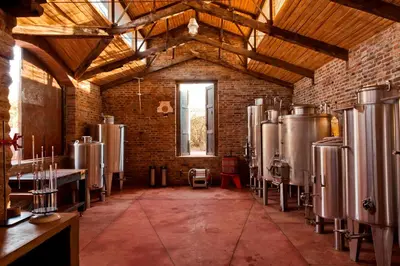 a room with a bunch of tanks in a building at LAS JARILLAS Hostería & Bodega in San Javier