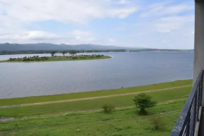 an island in the middle of a large body of water at Puerto del Águila Departamentos sobre el Lago - The View Luxury Aparts in Potrero de Garay