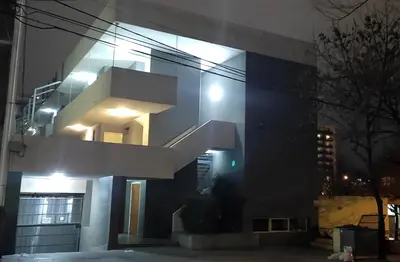 a building with a staircase on the side of it at 76 Arruabarrena in Villa Carlos Paz