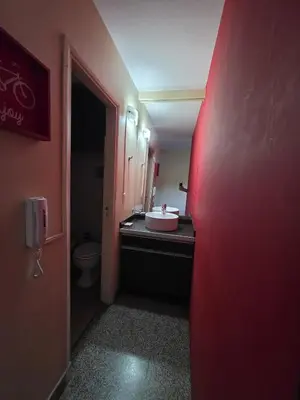 a bathroom with a sink and a toilet in a room at 76 Arruabarrena in Villa Carlos Paz