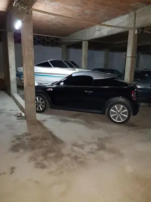 a black car parked in a parking garage at 76 Arruabarrena in Villa Carlos Paz