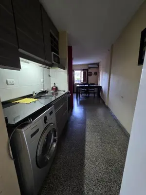 a kitchen with a washing machine in a room at 76 Arruabarrena in Villa Carlos Paz