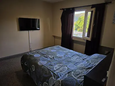 a small bedroom with a bed and a window at 76 Arruabarrena in Villa Carlos Paz