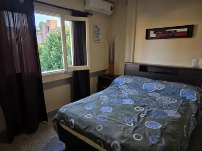 a bedroom with a bed and a window at 76 Arruabarrena in Villa Carlos Paz
