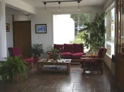a living room with a couch and a table at Hotel Terrazas del Rincon in Merlo