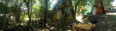 a small tent in the woods with a table at Cabañas Pancho Segunda Usina in Embalse