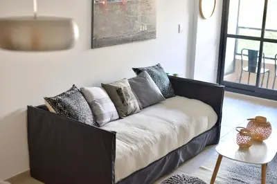 a black and white couch in a living room at 370 General Simón Bolívar in Cordoba