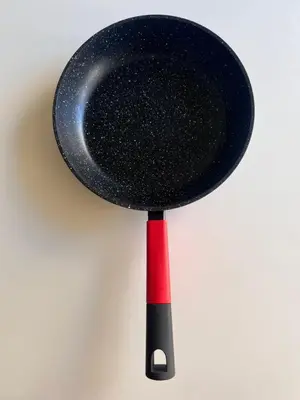 a black and red spatula with a red handle at 370 General Simón Bolívar in Cordoba