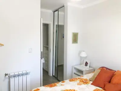 a bedroom with a bed and a walk in closet at VILLA MIA in Villa Carlos Paz