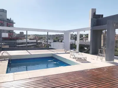 a swimming pool on the roof of a building at VILLA MIA in Villa Carlos Paz