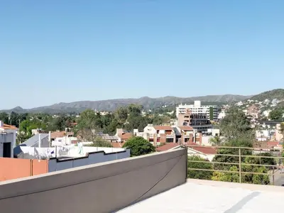 a view of a city from the roof of a building at VILLA MIA in Villa Carlos Paz