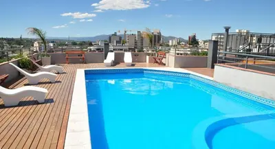 a swimming pool on the roof of a building at MIralejos II in Villa Carlos Paz
