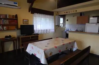 a room with a table with a table cloth on it at Casa en Playa Perelli in Villa Carlos Paz