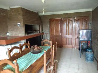a kitchen with a table with a bowl of food on it at La Rosada in Potrero de Garay