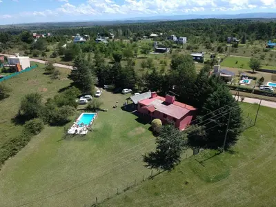 an aerial view of a house with a pool on a field at La Rosada in Potrero de Garay