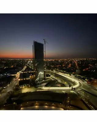 a view of a city at night with a building at DEPARTAMENTO SUITE DE LUXE EN EL CENTRO in Cordoba