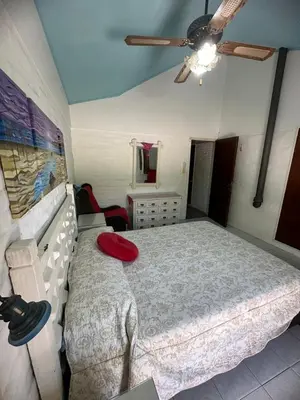 a bedroom with a bed with a red frisbee on it at Mi Sueño in San Antonio de Arredondo