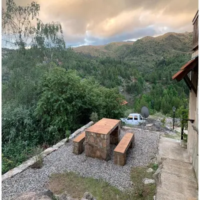 a view from the balcony of a house at La Ponderosa Cumbrecita in La Cumbrecita