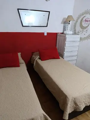 two beds sitting next to each other in a room at TEMPORARIO CORDOBA in Cordoba