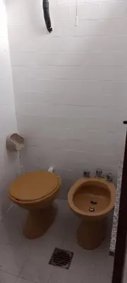a bathroom with a toilet and a bidet at TEMPORARIO CORDOBA in Cordoba