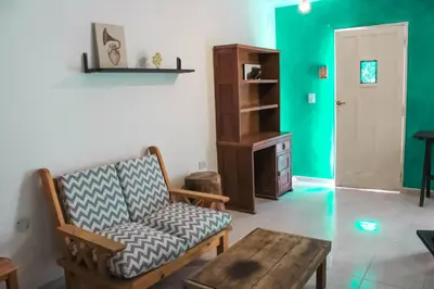 a living room with a couch and a table at flia Fortuna in Mina Clavero