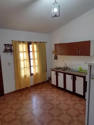 a kitchen with a sink and a counter top at Casa Grande in Villa Carlos Paz