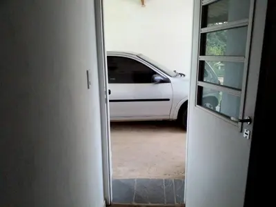 a white car is parked in a garage at Rumihuasi Apartamento in Los Reartes