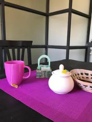 a purple table with a pink cup and a basket at Santa Rosa in Cordoba