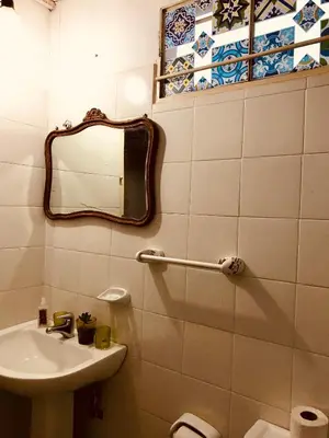 a bathroom with a sink and a mirror at Santa Rosa in Cordoba