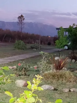 a garden with a view of the mountains at Mirador del Valle in Mina Clavero