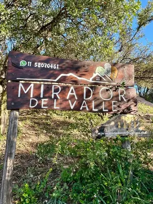 a sign for the entrance to a miterhibitedhibitedhibitedhibitedhibitedhibitedhibited at Mirador del Valle in Mina Clavero