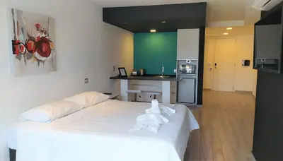a room with a bed with a towel on it at Domus Lake Resorts in Villa Carlos Paz