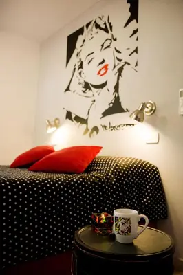 a bedroom with a bed with a coffee cup on a table at COSTA COM Departamentos de Montaña in Merlo