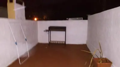 a room with a table in a white wall at Departamento MT 2 Barrio Jardín in Cordoba