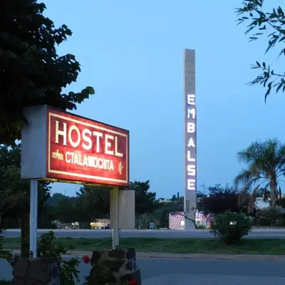 a sign for a hospital with a sign for a building at Hostel Ctalamochita in Embalse