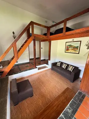 a living room with a couch and a loft at CASA PARA 6 PERSONAS MERLO SAN LUIS in Merlo
