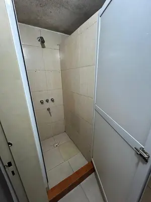 a bathroom with a shower with a shower at Central Paz Hostel in Villa Carlos Paz