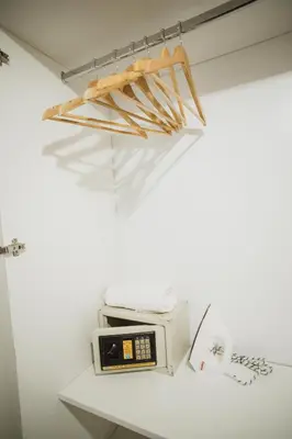 a microwave and a toaster on a shelf in a room at Casa Nuestra in Cordoba