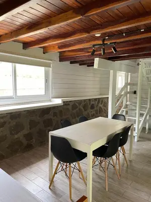 a dining room with a table and chairs at La Franca Cabaña de Veraneo in Villa General Belgrano