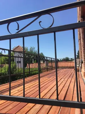 a balcony with a view of a wooden deck at Mi Refugio in Merlo