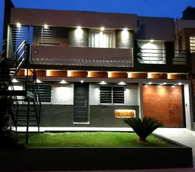 a house with a sign in front of it at Altos de Chacabuco Planta Baja Apartamento exclusivo premium con cochera gratis in Cordoba