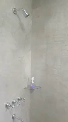 a shower with a glass shelf in a bathroom at Cabañas Kangarú in Santa Rosa de Calamuchita