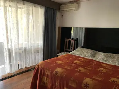 a bedroom with a bed and a large window at Gran casa del lago in Villa Ciudad de America