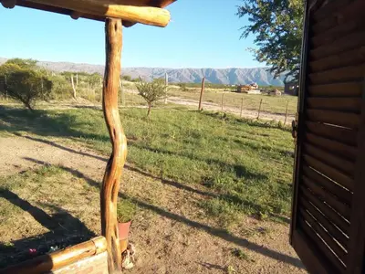 a piece of wood leaning against a house with a view at La Pirca in Nono