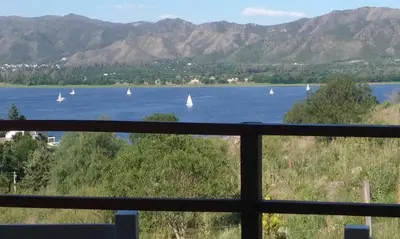 a view of a lake with boats in the water at Un Buen Lugar in Villa Parque Siquiman
