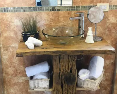 a bathroom with a sink and towels on a counter at CampoAlto Suites in San Javier