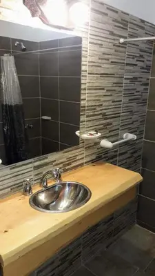 a bathroom with a sink and a mirror at Terrazas de mayu in Villa Icho Cruz